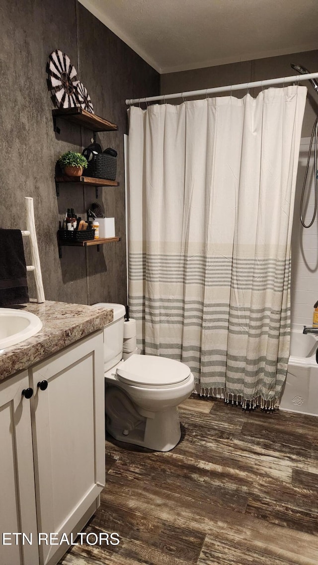 full bathroom with toilet, vanity, shower / tub combo with curtain, and hardwood / wood-style flooring