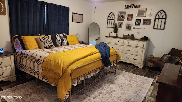 bedroom featuring dark wood-type flooring