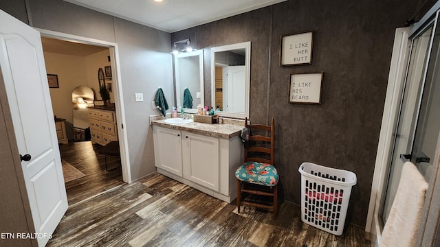 bathroom with hardwood / wood-style floors and vanity