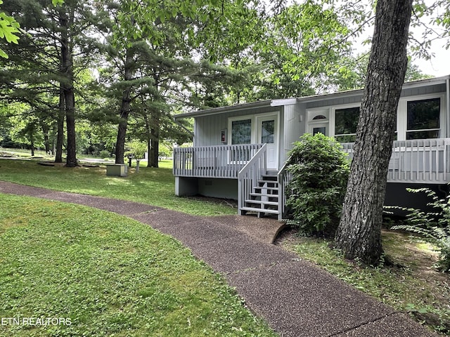 view of front of home with a front yard