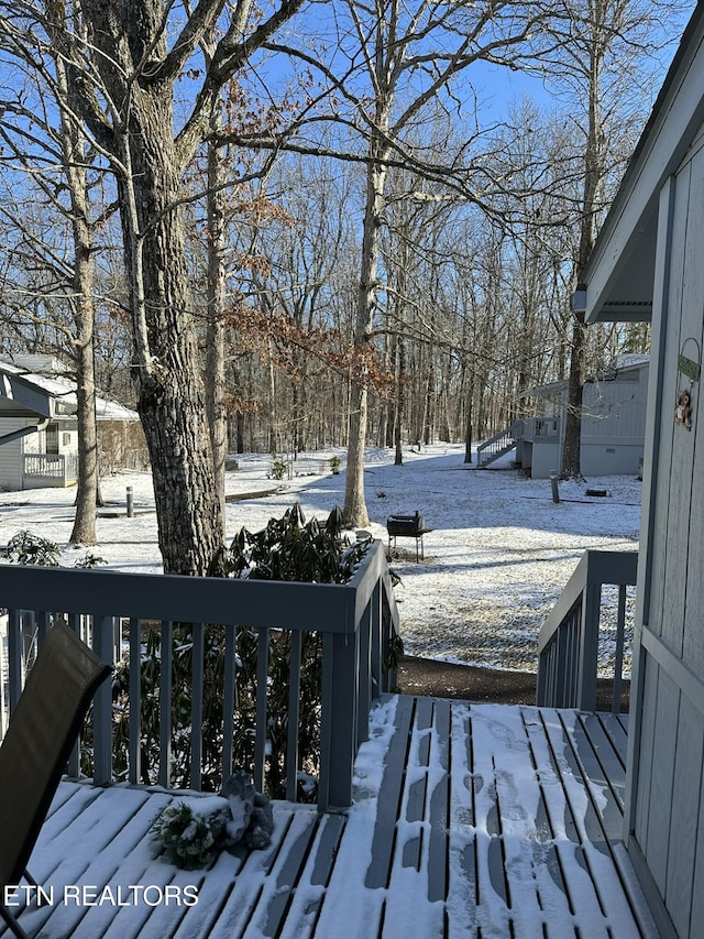 view of snow covered deck