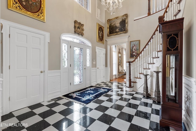 foyer with a notable chandelier