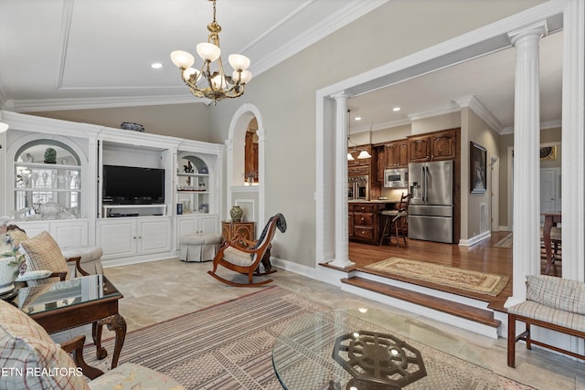 living room featuring a notable chandelier, ornamental molding, vaulted ceiling, and ornate columns