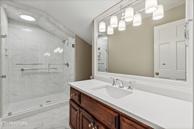 bathroom with walk in shower, vanity, and vaulted ceiling