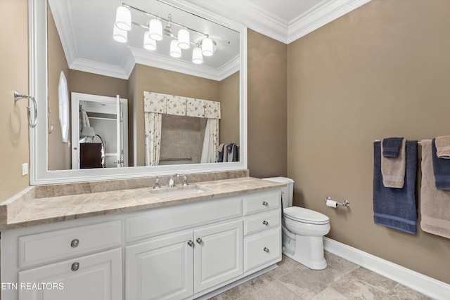 bathroom featuring vanity, ornamental molding, and toilet