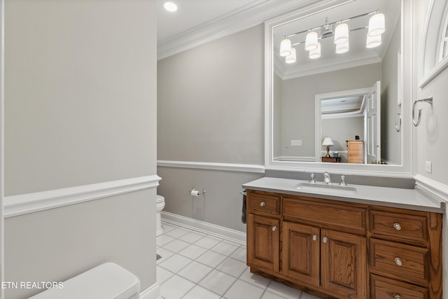 bathroom with crown molding, tile patterned floors, vanity, and toilet