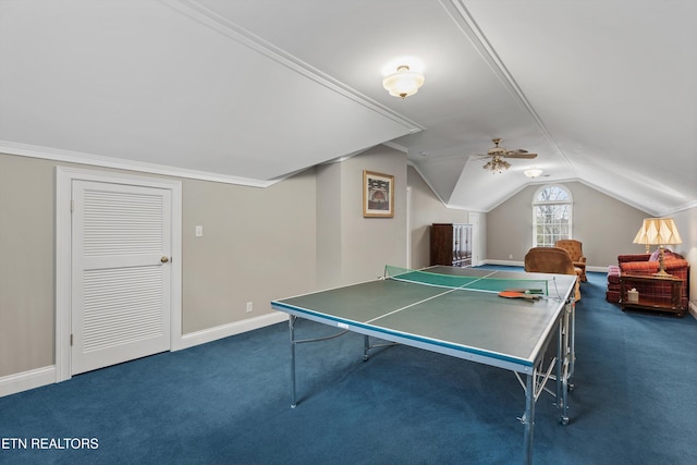 game room featuring dark colored carpet, vaulted ceiling, and ceiling fan