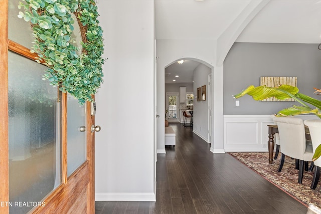 hallway with dark hardwood / wood-style floors