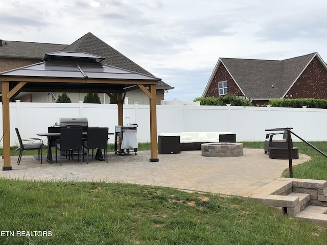 view of patio with an outdoor fire pit, a gazebo, and a grill