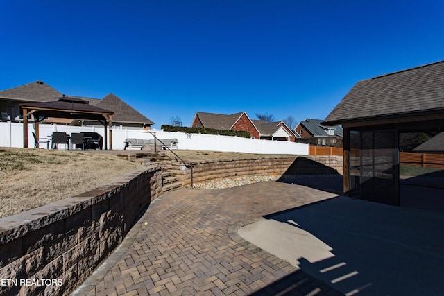 view of patio / terrace with a gazebo and a grill