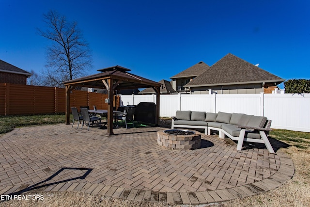 view of patio / terrace featuring an outdoor living space with a fire pit and a gazebo