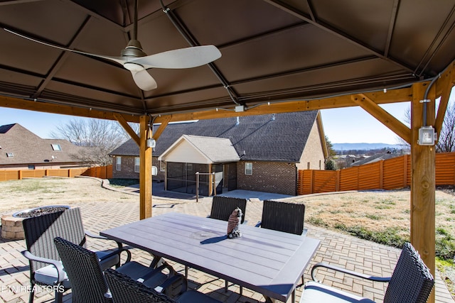 view of patio / terrace featuring ceiling fan and a gazebo