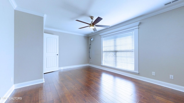 spare room with ceiling fan, dark wood-type flooring, and crown molding