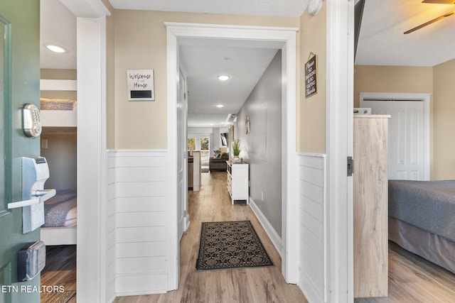 hall with light wood-type flooring