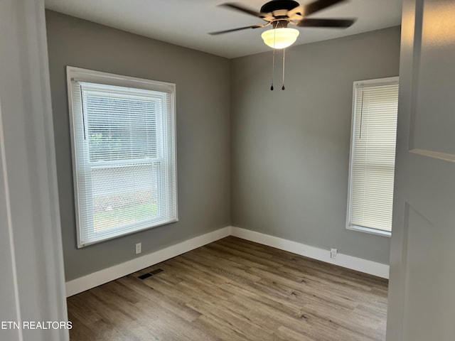 unfurnished room with ceiling fan and light hardwood / wood-style floors