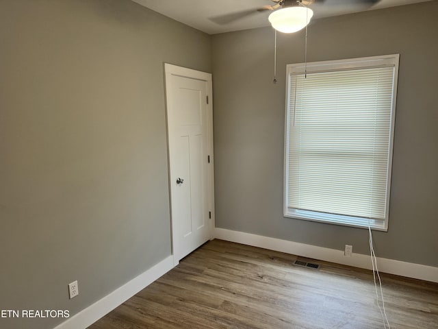 spare room with ceiling fan and hardwood / wood-style floors