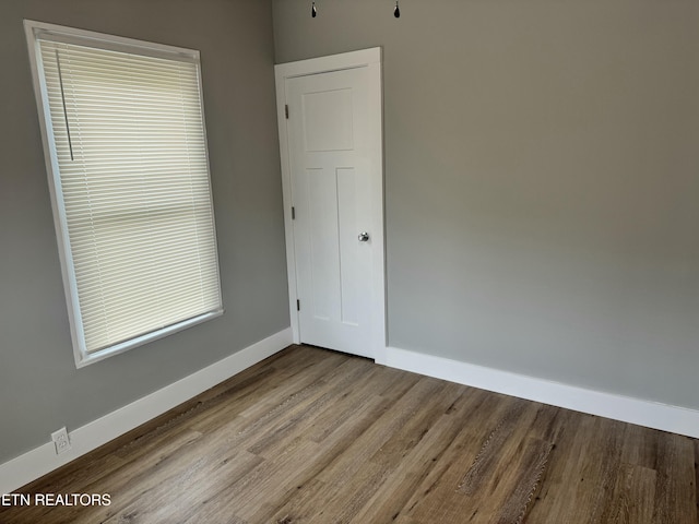 empty room with light hardwood / wood-style floors