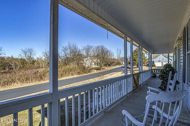 balcony featuring a porch