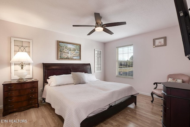 bedroom featuring ceiling fan and light hardwood / wood-style flooring