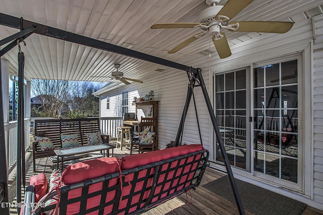 deck with ceiling fan and outdoor lounge area