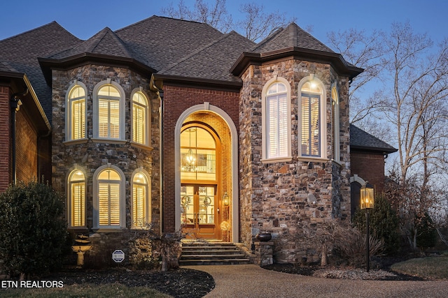 exterior entry at dusk with french doors