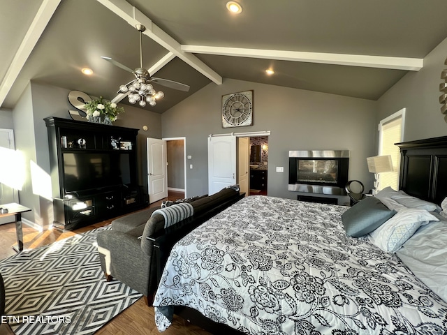 bedroom with vaulted ceiling with beams, hardwood / wood-style flooring, and ceiling fan