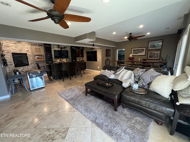 tiled living room featuring ceiling fan