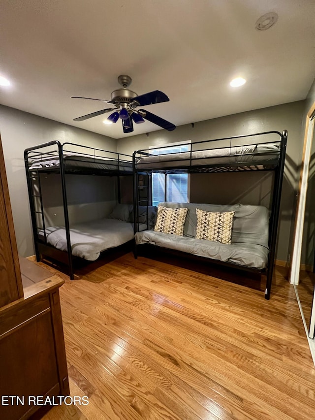 unfurnished bedroom featuring ceiling fan and light hardwood / wood-style floors