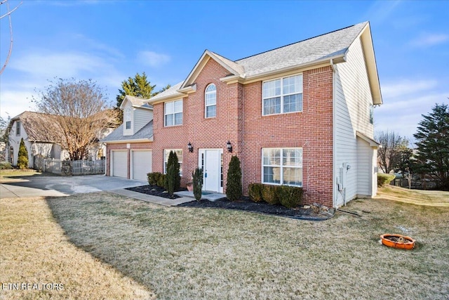 view of front facade featuring a front yard and a garage