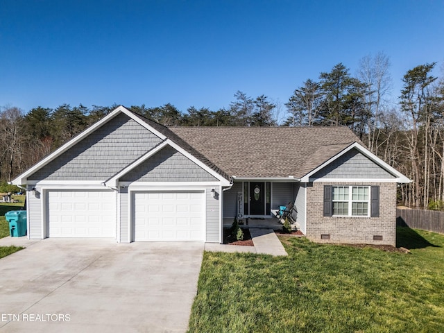 ranch-style home featuring a garage and a front lawn