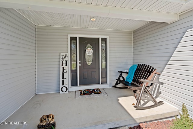 doorway to property featuring covered porch