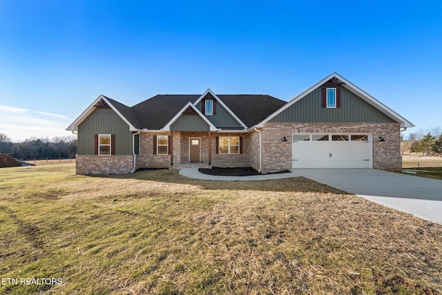 craftsman inspired home featuring a garage and a front lawn