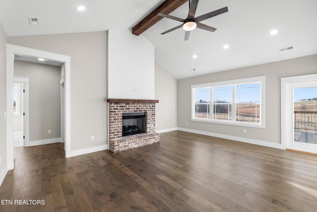 unfurnished living room featuring ceiling fan, dark wood-type flooring, vaulted ceiling with beams, and a fireplace