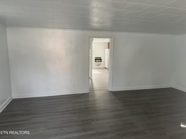 empty room featuring dark hardwood / wood-style floors