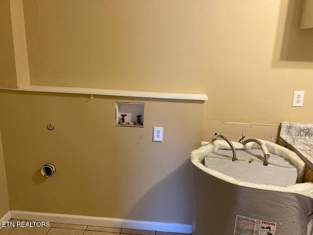 clothes washing area featuring tile patterned flooring, hookup for an electric dryer, and hookup for a washing machine