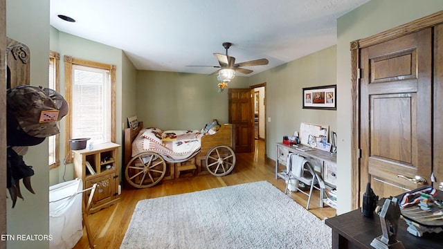 bedroom featuring ceiling fan and light wood-type flooring