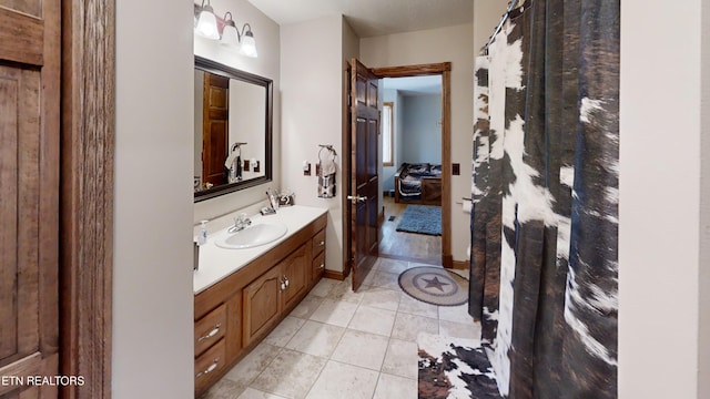 bathroom with tile patterned floors and vanity