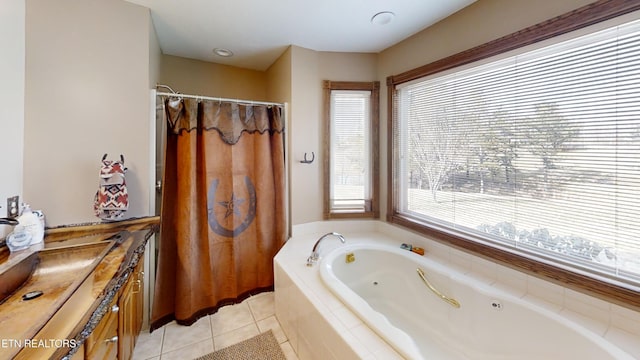 bathroom with vanity, plenty of natural light, tile patterned floors, and separate shower and tub