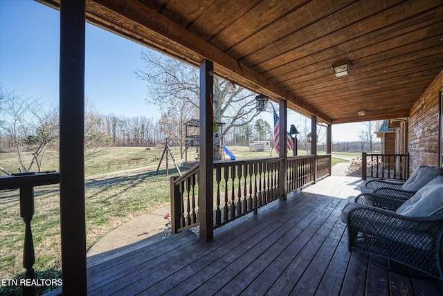 wooden deck with a playground