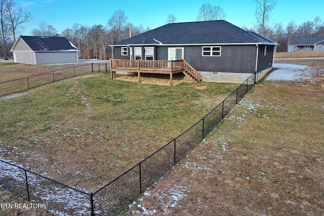 back of house with a deck and a lawn