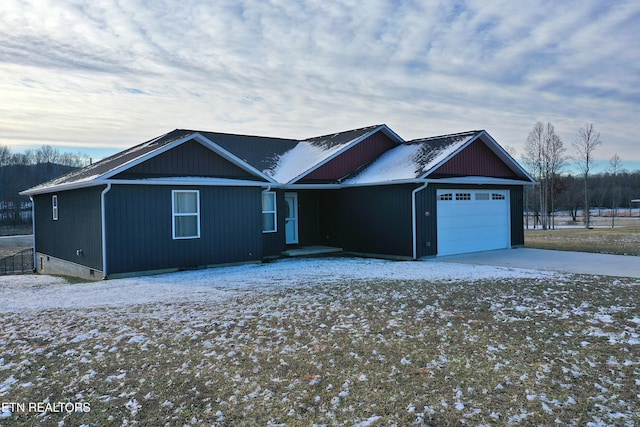 single story home with a garage