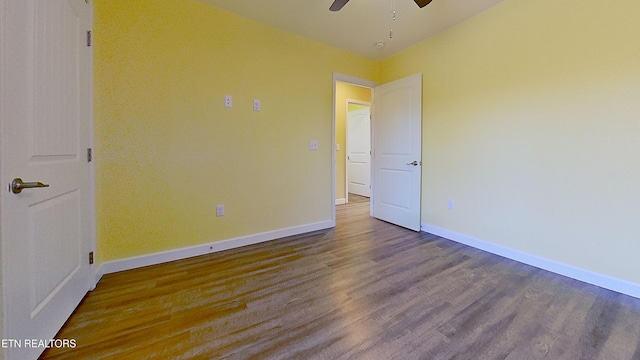 spare room featuring hardwood / wood-style flooring and ceiling fan