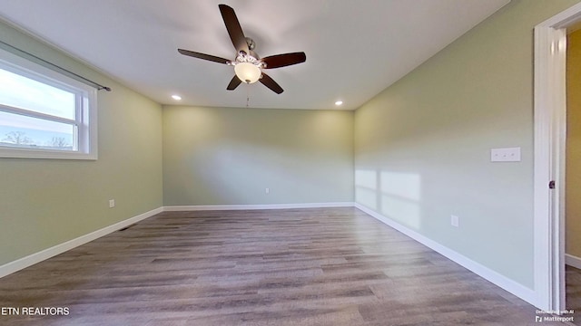 spare room featuring ceiling fan and light wood-type flooring