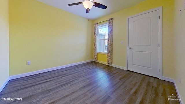 spare room featuring wood-type flooring and ceiling fan