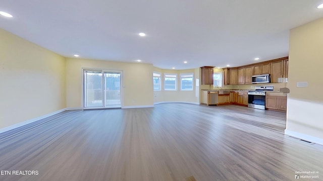 unfurnished living room featuring light hardwood / wood-style flooring