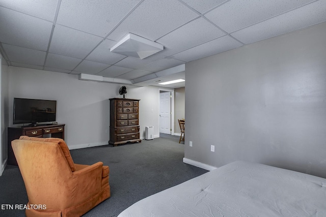 carpeted bedroom with a paneled ceiling