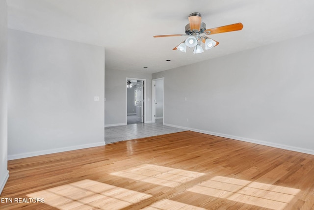 unfurnished room with ceiling fan and light hardwood / wood-style flooring