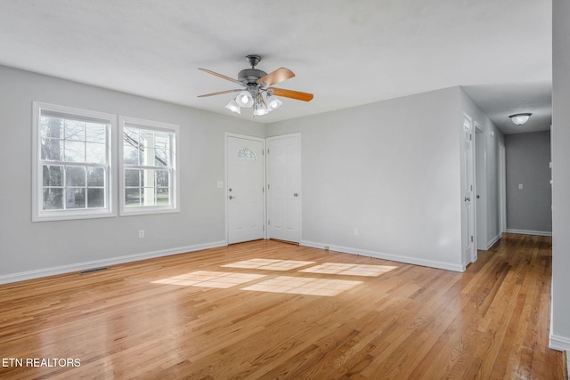 spare room with ceiling fan and light hardwood / wood-style flooring