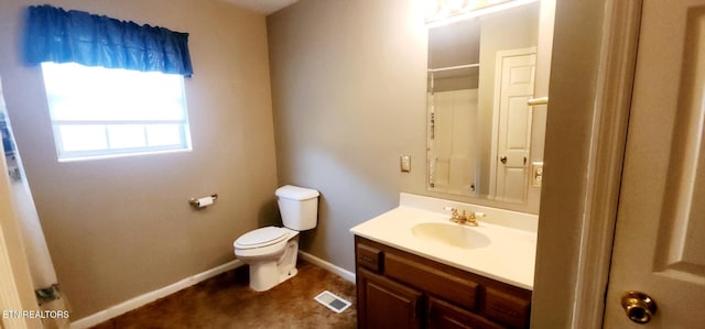 bathroom featuring toilet and vanity