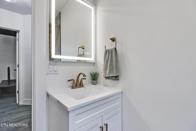 bathroom featuring hardwood / wood-style floors and vanity